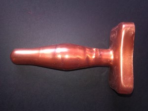 A copper Tantus Butt Plug